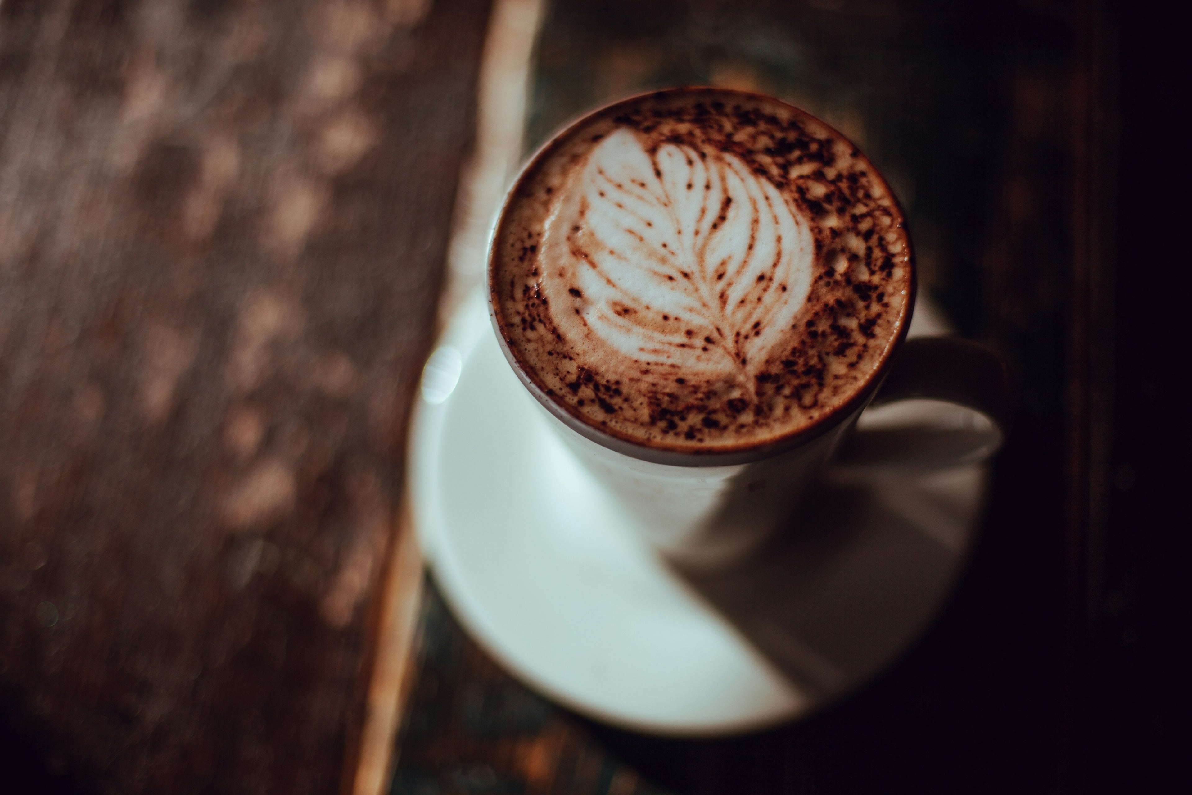 Coffee with laté art of a flower